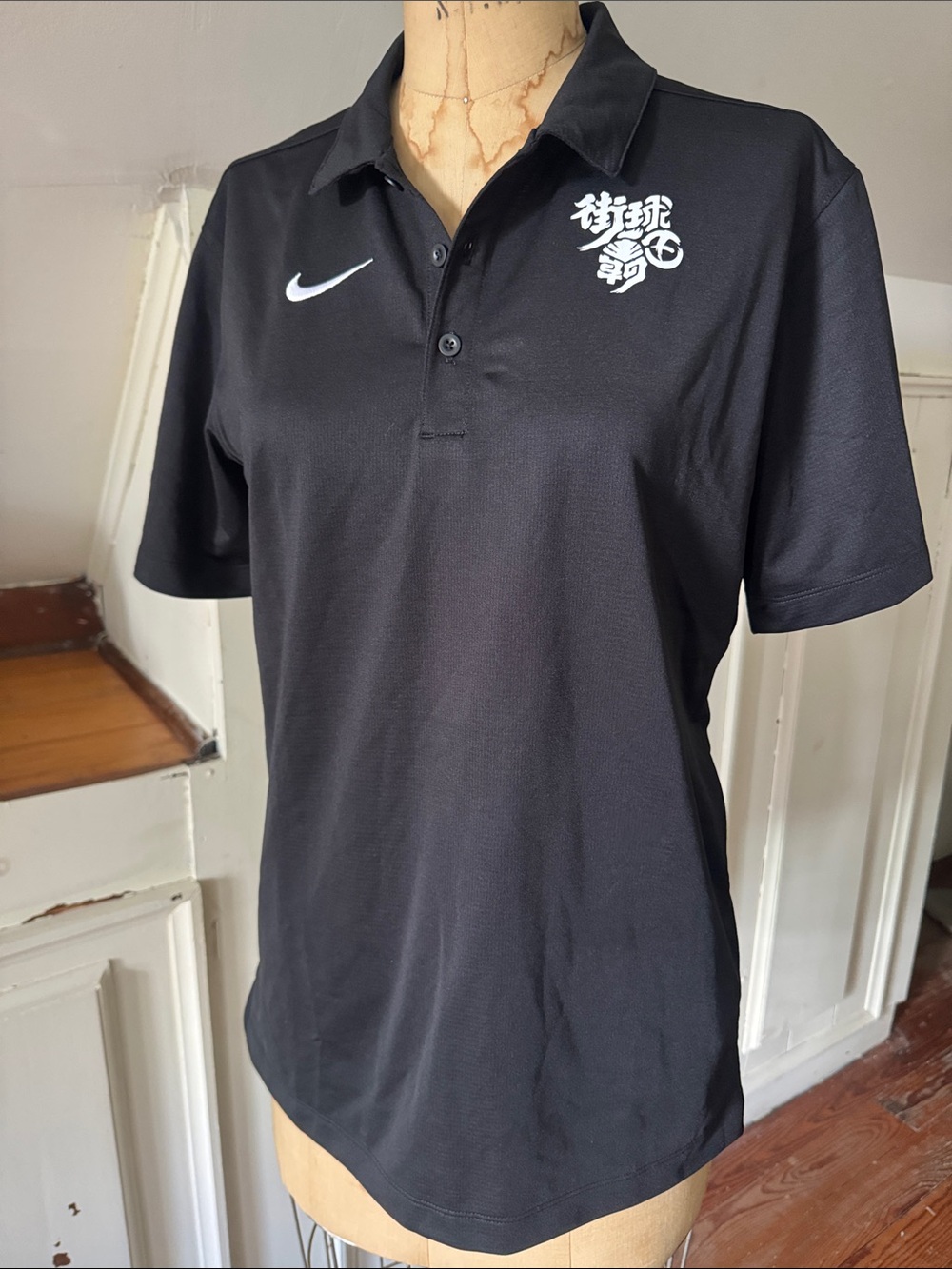 Nike Black Polo with White Swoosh and Chest Graphic